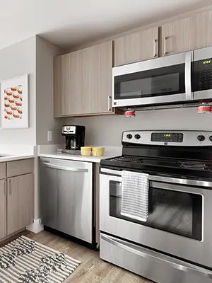 apartment kitchen with cabinets and appliances