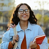 young woman walking to class